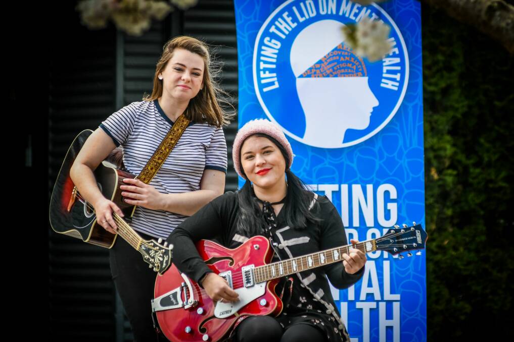 RELAX: Denni Sulzberger and Bianca Jago lifted the lid on mental health, at the Tramsheds on Monday by performing at a barbecue that aimed to make the community stronger together. Picture: Phillip Biggs. 