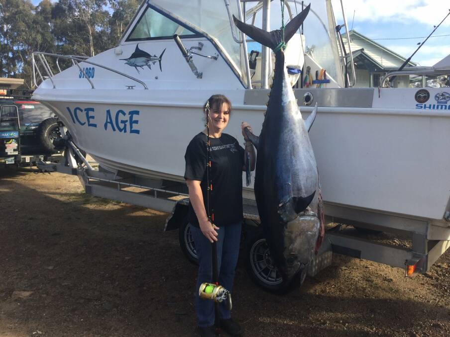 BIG ONE: Melissa McGiveron with her 126 kilogram tuna caught last week at St Helens. Picture: supplied/Jason McGiveron