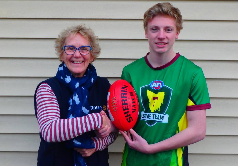READY: Longford Rotary Club president Kathy Farr presents Longford's Isaac Chugg with $250 to take part in the National Schoolboys Carnival in Western Australia on July 21. Picture: supplied. 