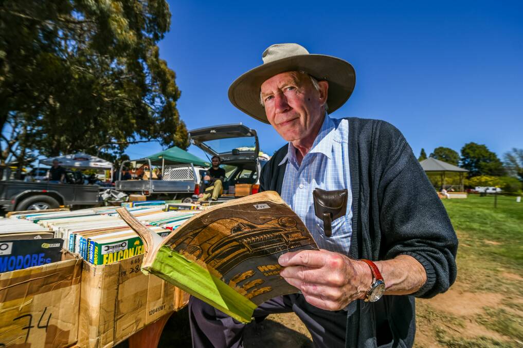 FANATIC: Trevor Bolidstone of Devonport, travelled to Longford on Sunday in a bid to sell some of his books about cars. He brought more than 900 books with him, and said he left more at home. Pictures: Phillip Biggs