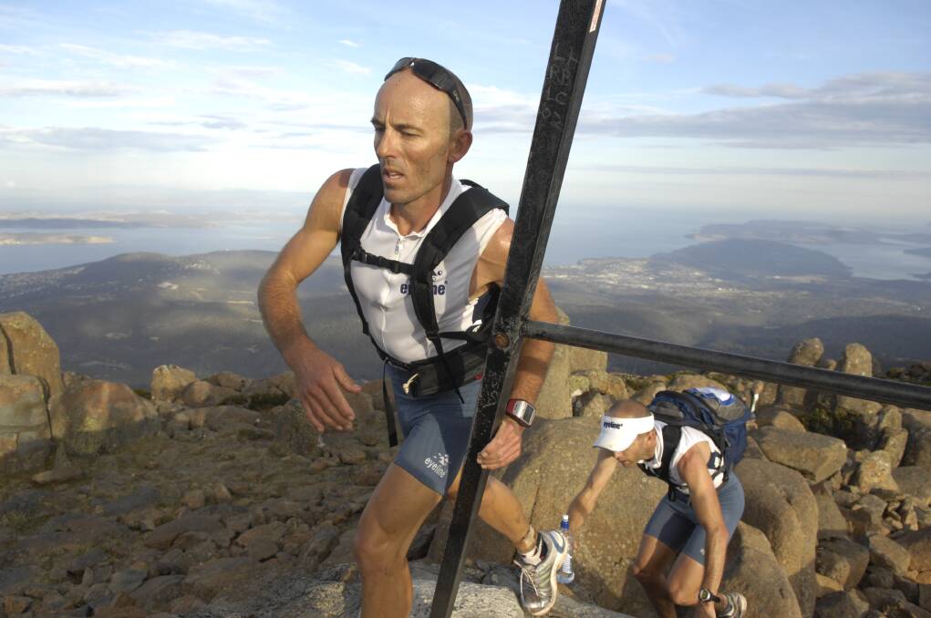 24/03/2008 Runners Paul McKenzie and Mark Guy close on the check point at the top of Mt Wellington, Hobart on their way to a near record run in the Australian Three Peaks race.