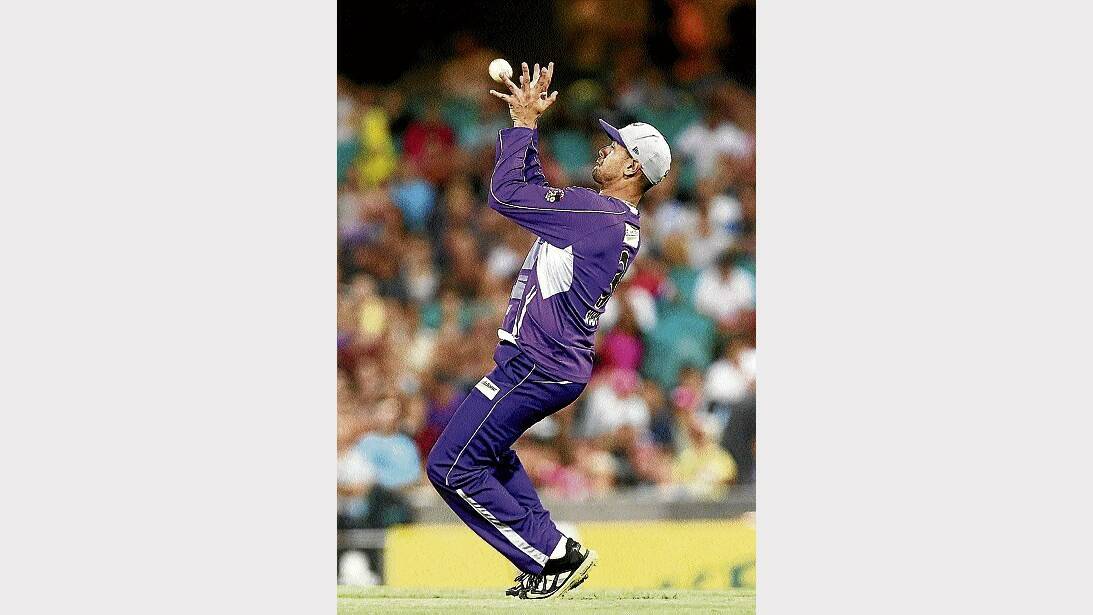 Hobart's Owais Shah takes a catch to dismiss Marcus North, of the Sixers, last night. Picture: GETTY IMAGES