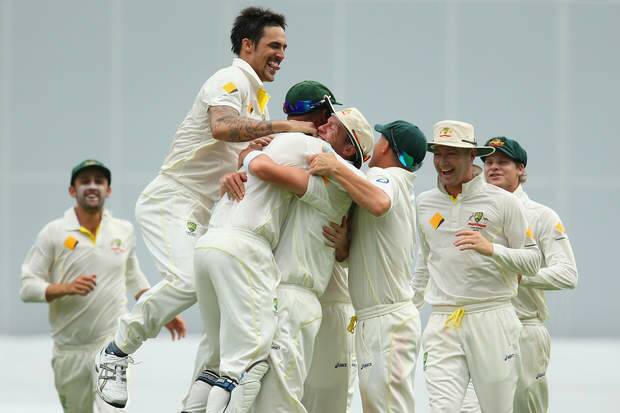 BRISBANE, AUSTRALIA - NOVEMBER 24:  The Australia team celebrate after Mitchell Johnson of Australia took the wicket of Stuart Broad of England during day four of the First Ashes Test match between Australia and England at The Gabba on November 24, 2013 in Brisbane, Australia.  (Photo by Mark Kolbe/Getty Images) Photo: Mark Kolbe