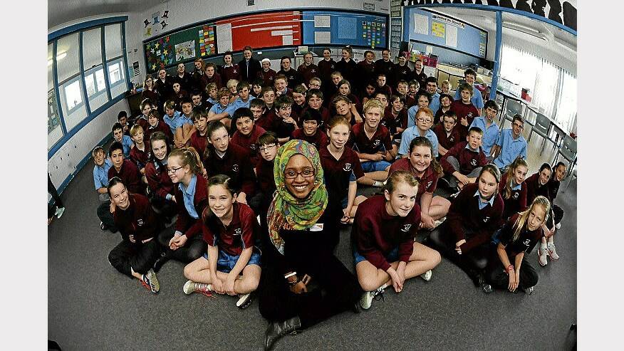 World Vision Youth Ambassador for Victoria and Tasmania Soreti Kadir with Riverside Primary grade 6 pupils. Picture: PAUL SCAMBLER