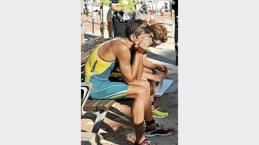 Elite men's winner Aaron Royle and second placegetter Ryan Fisher catch their breath after the race on Saturday.