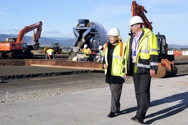 Launceston Airport general manager Pamela Graham and project manager Ray Brown inspect progress on the apron.	