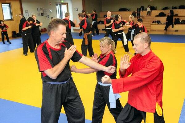 Lindsay Scott and Melinda Lee, both of Launceston, with wing chun kung-fu instructor Leigh Duff in Launceston yesterday.  Picture: PAUL SCAMBLER