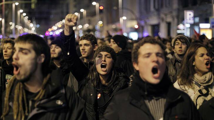 Protesters shout slogans during a general strike in Madrid that has grounded more than 700 flights.