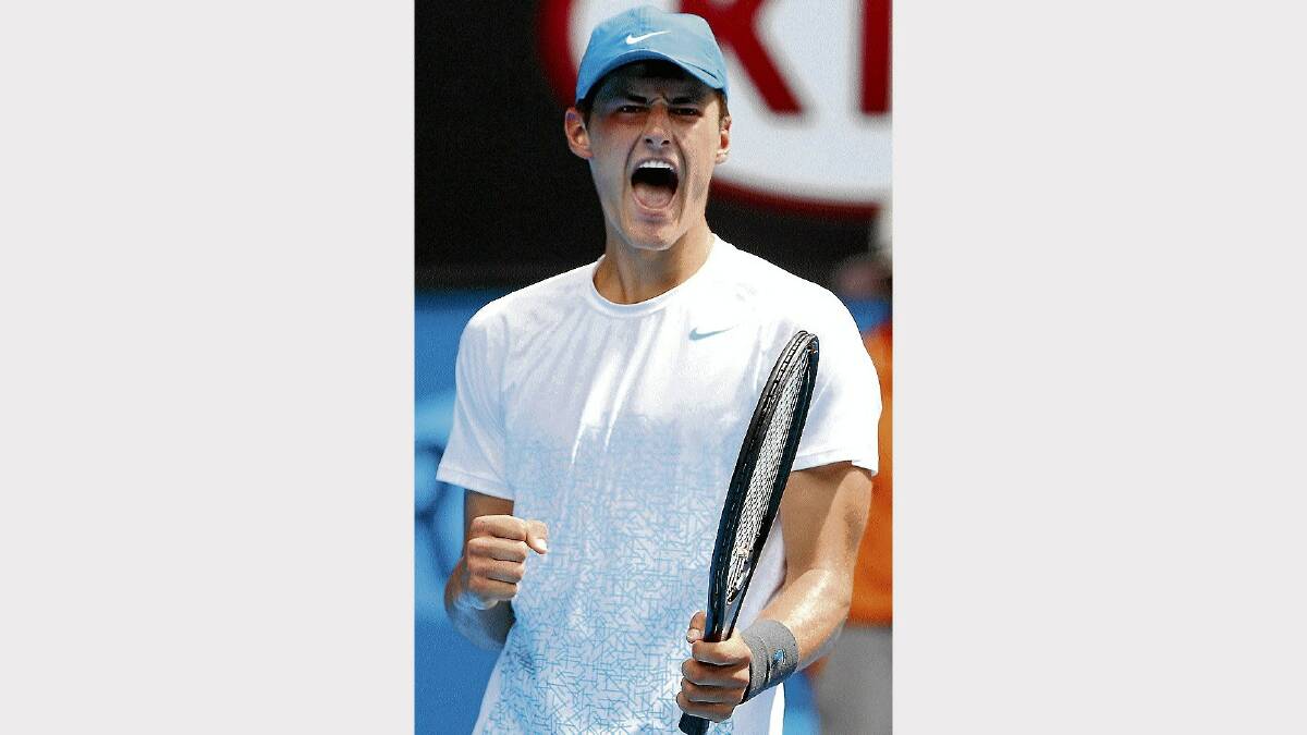 Bernard Tomic celebrates his second-round win over German Daniel Brands yesterday. Picture: GETTY IMAGES