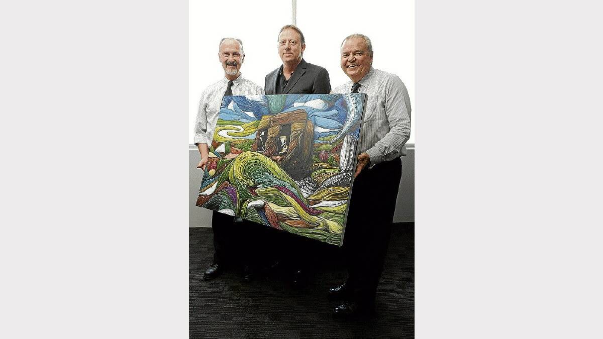 John Glover Society chairman Andrew Heap is flanked by at+m integrated marketing's Eddie Mallinson and David Peck with the winning 2011 Glover Prize painting by Josh Foley.  Picture: MARK JESSER