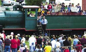 ALL HANDS ON DECK: Meander Valley Mayor Mark Shelton addresses about 300 Deloraine residents who rallied yesterday to save the town's landmark locomotive - among them children with a blunt message. Pi