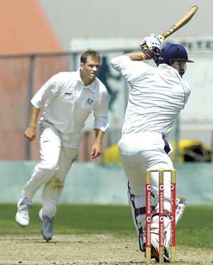 On the attack: Riverside's Darren Simmonds smashes Launceston bowler Michael Routledge to the boundary in yesterday's NTCA. Picture: Neil Richardson.