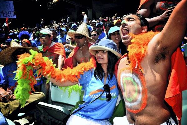 India's Swami Army supporters Vasudha Jampala and her husband Rakesh join a large contingent cheering India yesterday at the MCG.