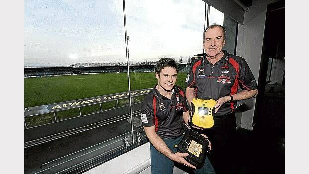 North Launceston coach Zane Littlejohn and general manager Rob Donnelly with the new defibrillator. Picture: WILL SWAN