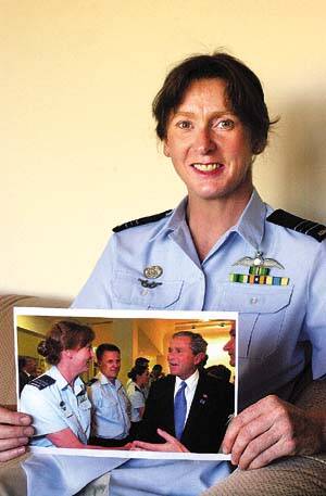 HONOURED: Linda Corbould with a photo of her meeting with President Bush. Picture: TIM HUGHES