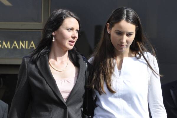 Susan Blyth Neill-Fraser's daughters Emma Fraser-Meeker (left) and Sarah Bowles leave the Supreme Court in Hobart yesterday. Picture: Loretta Johnston.