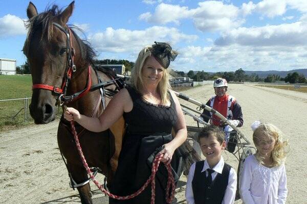 Fashions on the Field entrant Bec Young with horse Daisy Adele, Callum Spencer, 6, reinsman Andrew Arnott and Adele Arnott, 7. Picture: MICHAEL LOWE