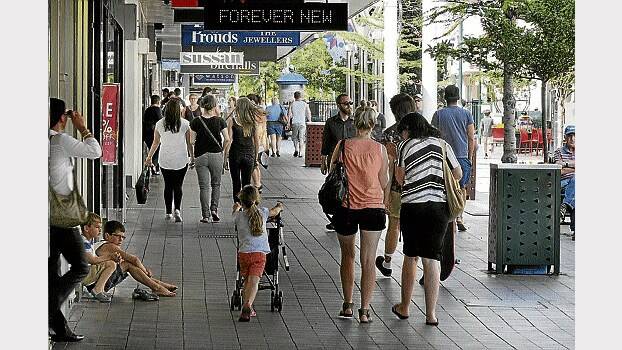 Shoppers in the Brisbane Street Mall yesterday ... stores are still bursting with sale items. Picture: PAUL SCAMBLER