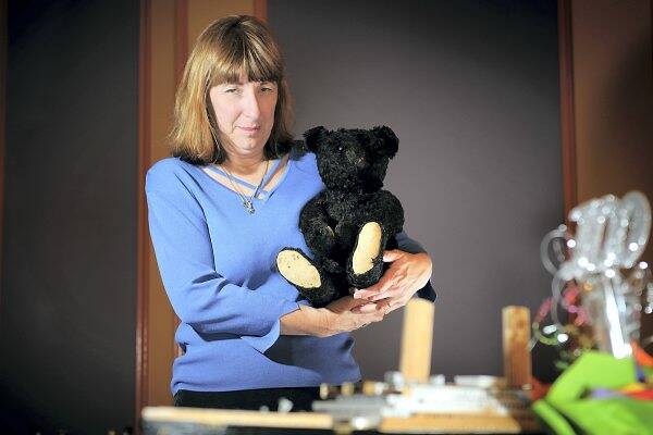 Kerri Beggs with a rare Titanic Mourning Bear that belongs to her sister Sonia. The bear will be on display at today's doll and bear fair.