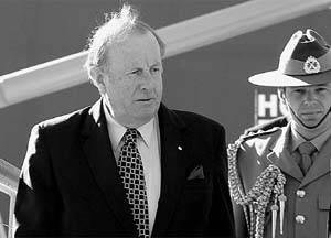 REPUTATION: Governor Sir Guy Green and an aide arrive for the Lions Clubs convention in Hobart yesterday.
