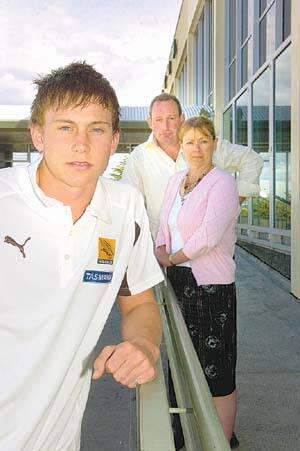 Hawthorn's latest recruit Mitchell Thorp, 17, with his parents Peter and Mandy Thorp at Launceston Airport after arriving home from yesterday's AFL draft in Melbourne. Picture: Paul Scambler.