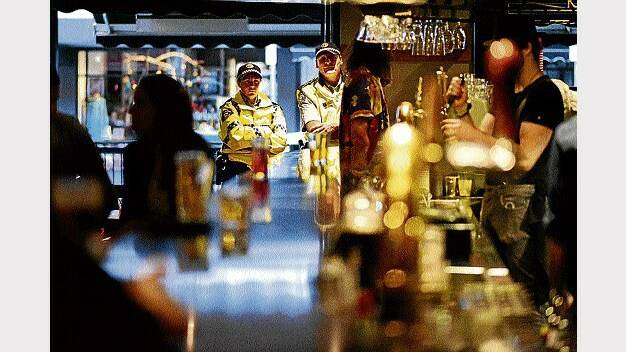Launceston police officers watch over proceedings at the Star Bar last night. Picture: SCOTT GELSTON