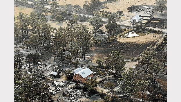 An aerial shot of properties near Dunalley after a bushfire devastated the area. Now the fire has been downgraded, the clean-up task begins.