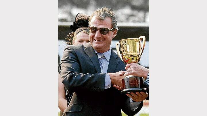 Trainer Darren Weir with the Hobart Cup ... he stands to win a neat bonus if Hurdy Gurdy Man wins the Launceston Cup.