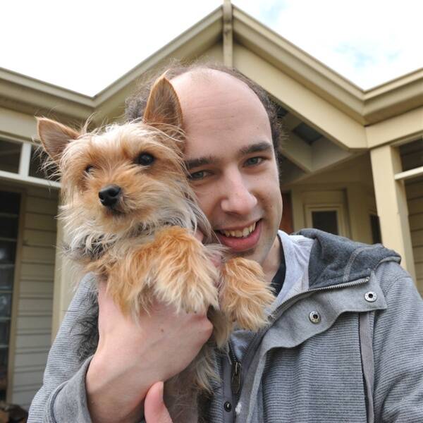 Rowan MacDonald and his dog Rosie outside their home.