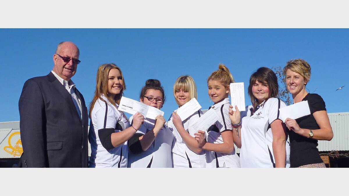 George Town Mayor Roger Broomhall presents plane tickets to Port Dalrymple High School students Mikayla Riley, Courtney Gibbons,  Madison Nielsen, Emma Kruijuer, Shaniya Richardson and program co-ordinator Jodie Clifford. Picture: supplied.