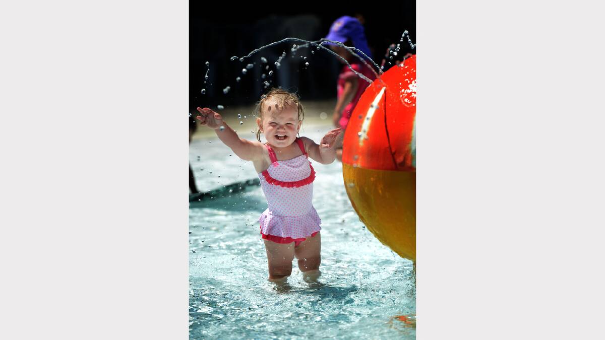Eighteen-month-old Lilly Austen, of Norwood, splashes around in the sun at the Launceston Aquatic Centre. Picture: Scott Gelston