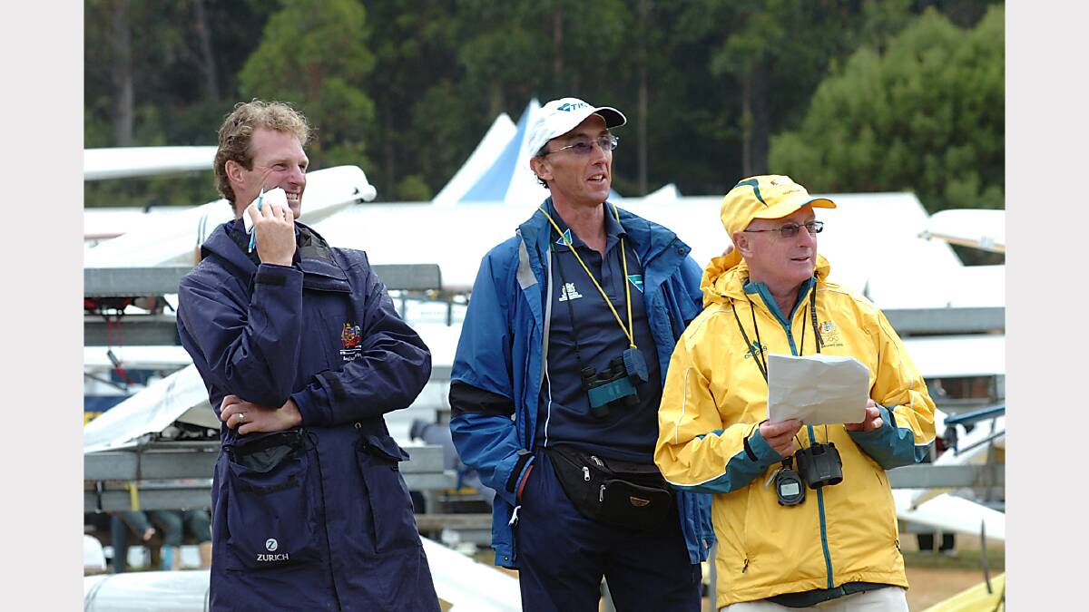 State development officer Anthony Edwards, TIS coach Ron Batt and national men's rowing coach Noel Donaldson watch events at Lake Barrington in 2009.