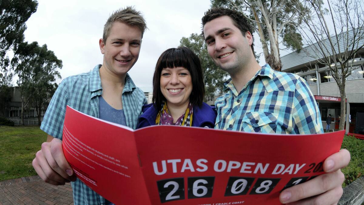  Geoff Stick and Sam Hay, from the Amazing Race Australia, with University of Tasmania open day co-ordinator Carla Baker.  Picture: PAUL SCAMBLER