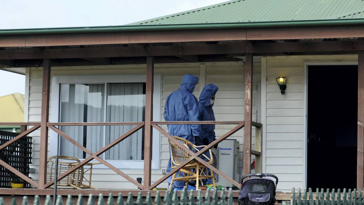 A police forensics team at the scene of the alleged murder at George Town.     Picture: GEOFF ROBSON