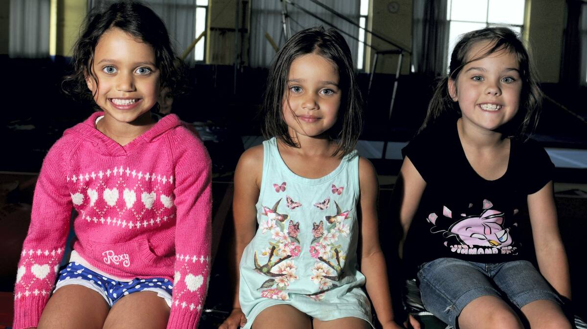 Indra, 6, and Lilly Gurudoss, 4, and Jaime Drummy, 7, enjoy the holiday activities at the PCYC in Newstead.    Picture: GEOFF ROBSON