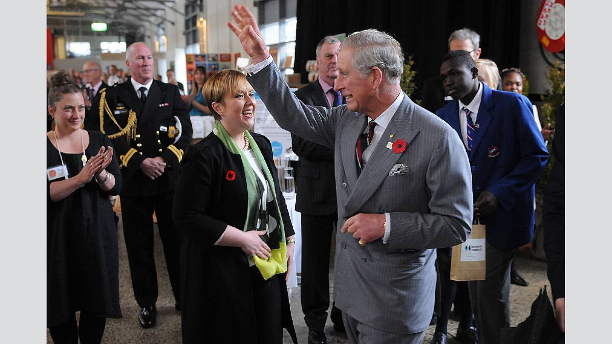 Thursday November 8 2012  photo:  Phillip Biggs  report:  Rose Bolger Diamond jubilee reception, Princes Wharf no 1 shed for Prince Charles and Duchess of Cornwall Camilla: Tasmanian Premier Lara Giddings tries to shake Prince Charles' hand as he strides out of the rain, past the welcome party into the reception.