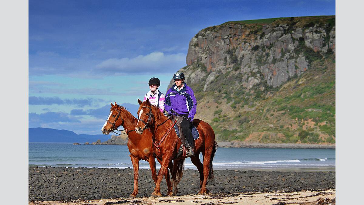 Tuesday July 31 2012  photo:  Phillip Biggs  report:  Jodie Stephens Irish Town riders Kelsey Bramich on Chillie and Kristy Fry (in purple) riding Brandy at Stanley, North West Tasmania.