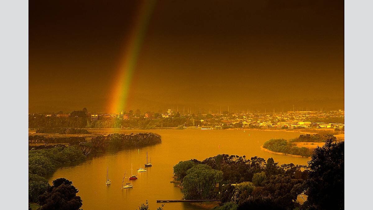 Saturday  October 20 2012  photo:  Phillip Biggs Late afternoon rainbow over Tamar River at Tailrace, Launceston.