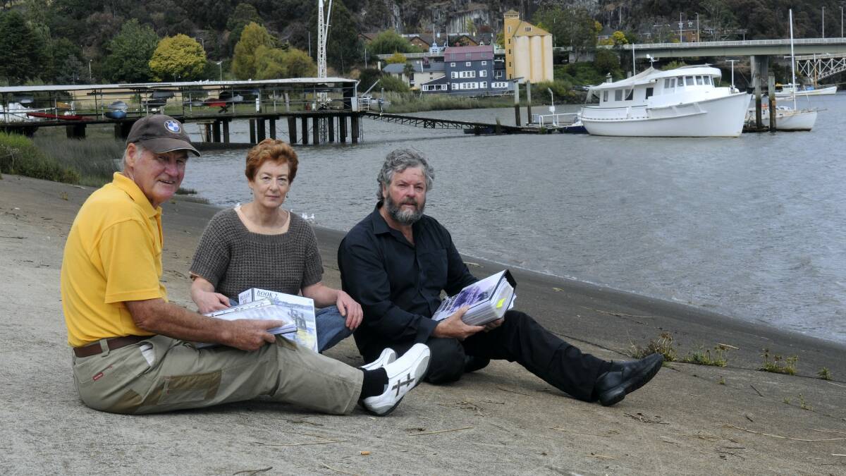 Alan Atkins and Anne Layton-Bennett, of Launceston, discuss the city's sewerage and stormwater system with Greens MHA Kim Booth at Royal Park. Picture: PAUL SCAMBLER