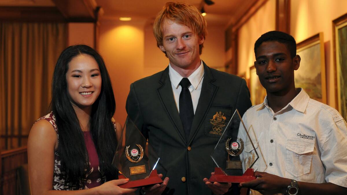 Award winners Grace Hinds and Getasew Ferguson with Tasmanian Olympian Tristan Thomas.