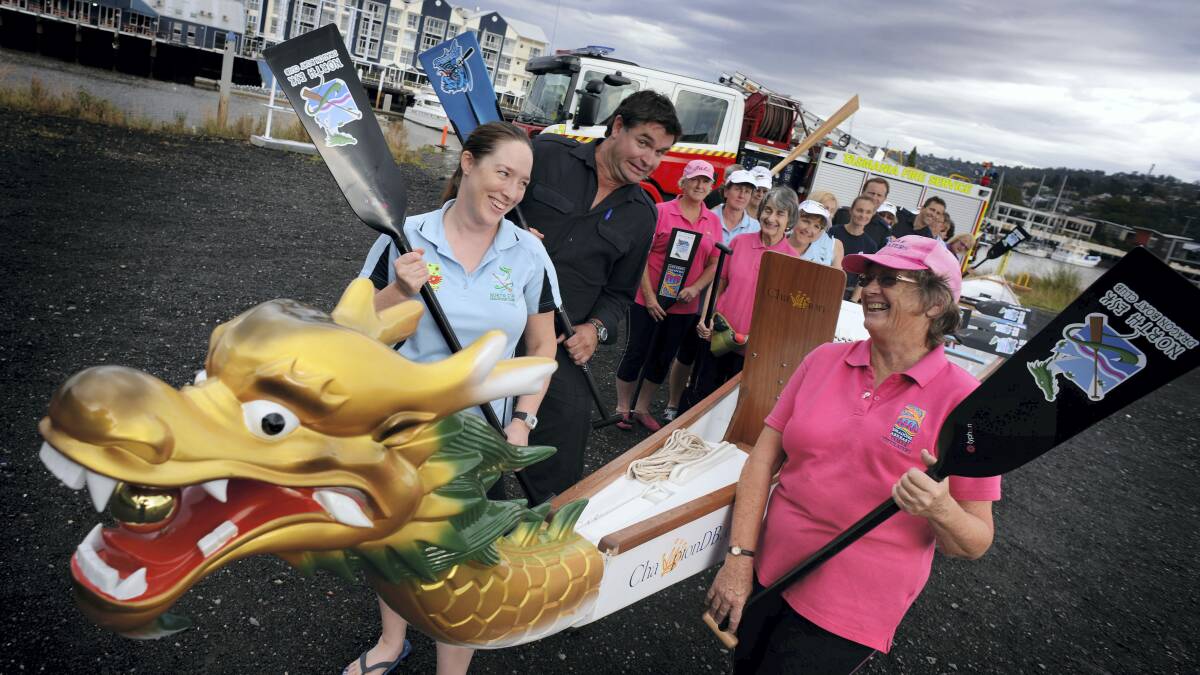 North Esk's Kelly Broomhall, Launceston Fire Brigade's Jeremy Paterson and Dragons Abreast North Tasmania's Beth Sowter gear up for the dragon boat event. Picture: SCOTT GELSTON