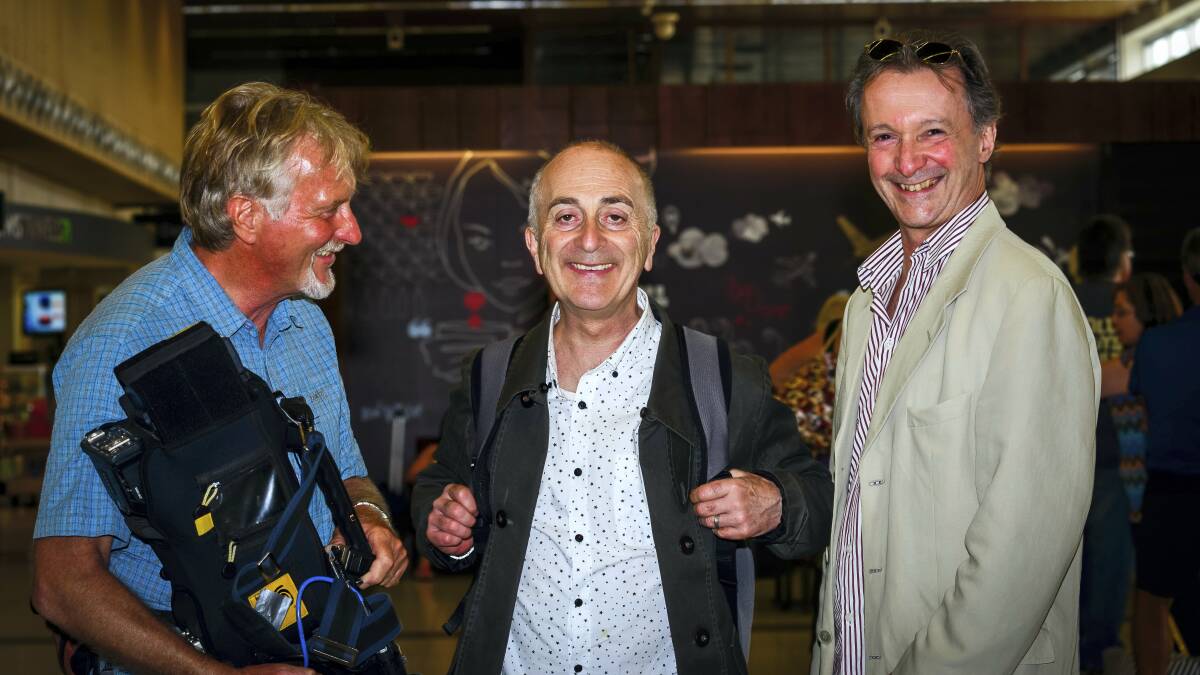Sir Tony Robinson (centre) with cameraman Peter Zakharov and producer Sean Gilmartin on their arrival at Launceston Airport.
