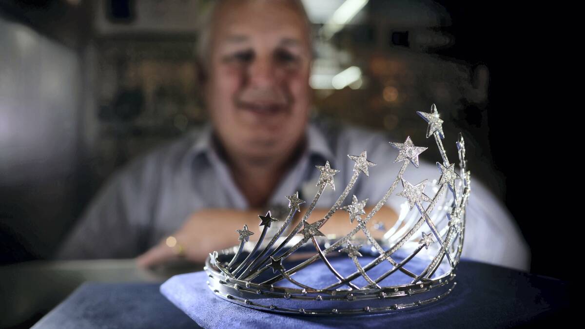 Watsons Showcase Jewellers owner Neil Watson with Miss Universe Australia 2013 Olivia Wells's crown, which is on display until Saturday. Picture: SCOTT GELSTON