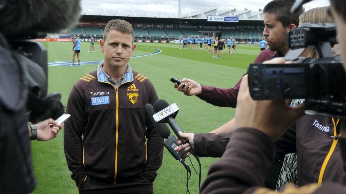 Stand-in Hawks coach Brendon Bolton addresses the media at Aurora Stadium yesterday.