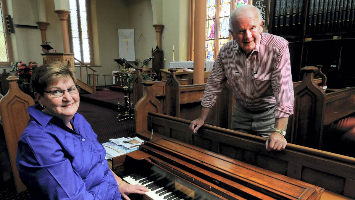 Longford Anglican church parishioners Jenny Williams and Terry Heggaton with the church's restored seraphine organ.   Picture: GEOFF ROBSON