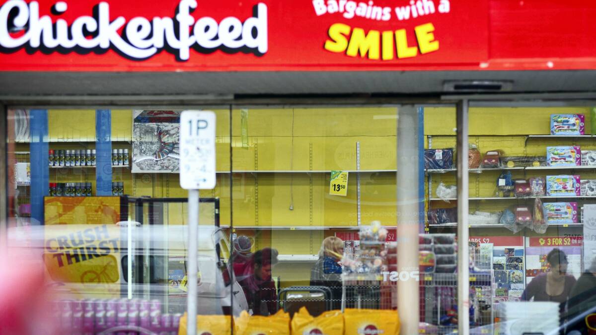 Empty shelves can be seen from outside Chickenfeed's Launceston store . . . the discount chain's owner, Retail Adventures, has refused to comment on speculation it is on the verge of financial collapse.  Picture: SCOTT GELSTON