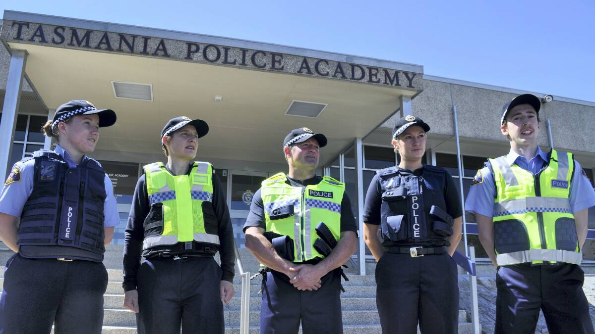 Tasmania Police recruits model different protective vests to be used in the trial.