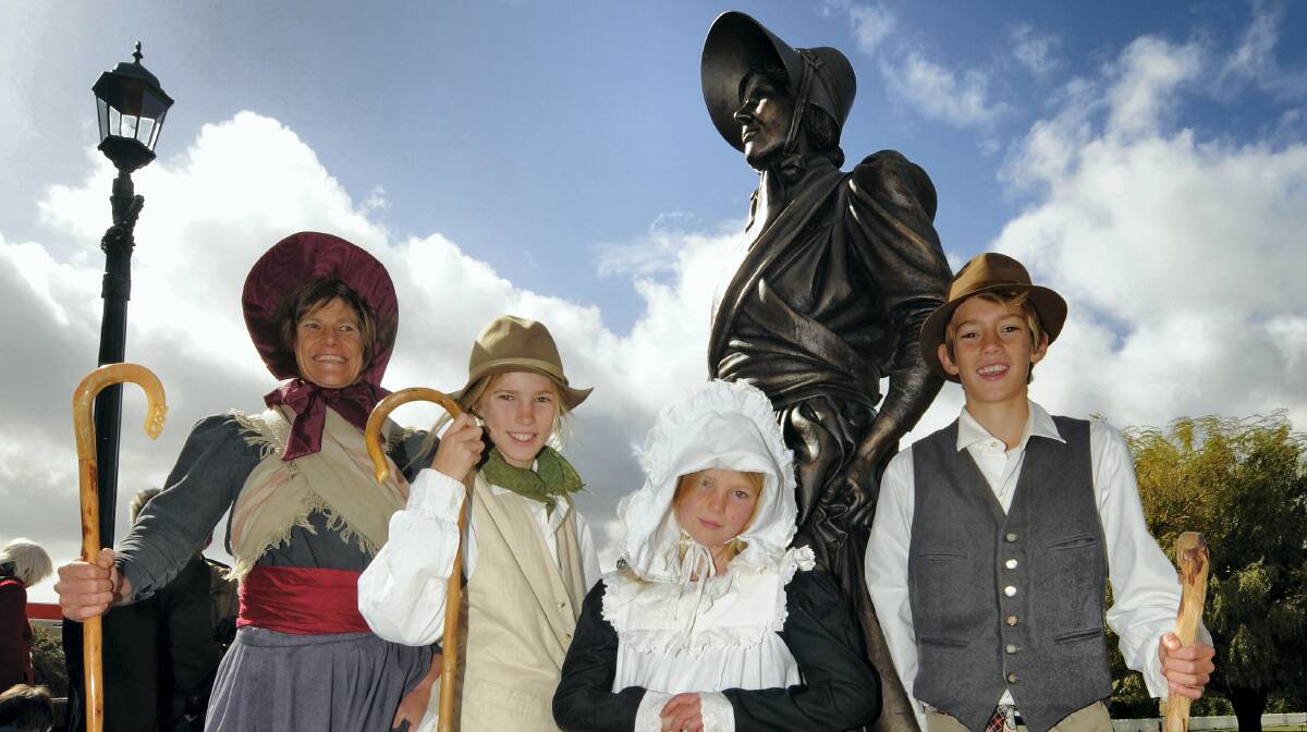 The model for Eliza Furlonge sculptor Peter Corlett Tiffany Alp, of Melbourne, with her children Alexandra, 11, Samantha, 8, and Jock, 12. Picture: PHILLIP BIGGS   