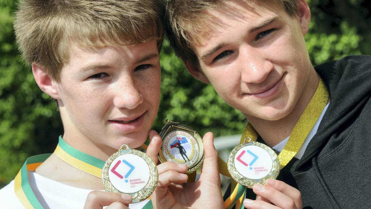 Showing off their boxing medals  are Bailey Seabourne, 13,  and his brother  Jack, 15,  of  Bridgenorth. Picture: PAUL SCAMBLER  
