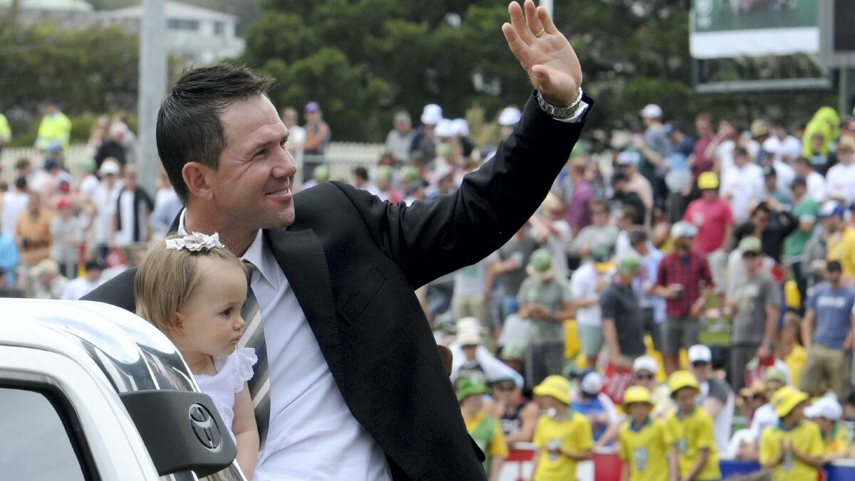 Ricky Ponting with daughter Matisse on his lap of honour during the Test lunch break at Bellerive yesterday.  Picture: WILL SWAN   